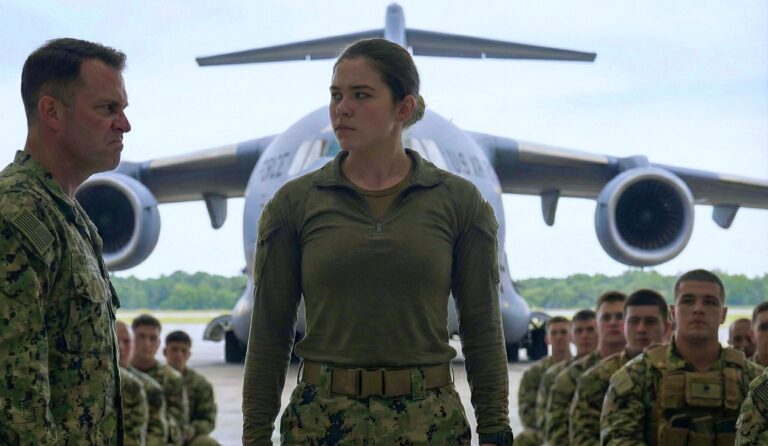 The SEAL captain’s voice echoed: “Any combat pilots here?” For a moment, absolute silence. Then she rose slowly — and the captain’s expression said everything